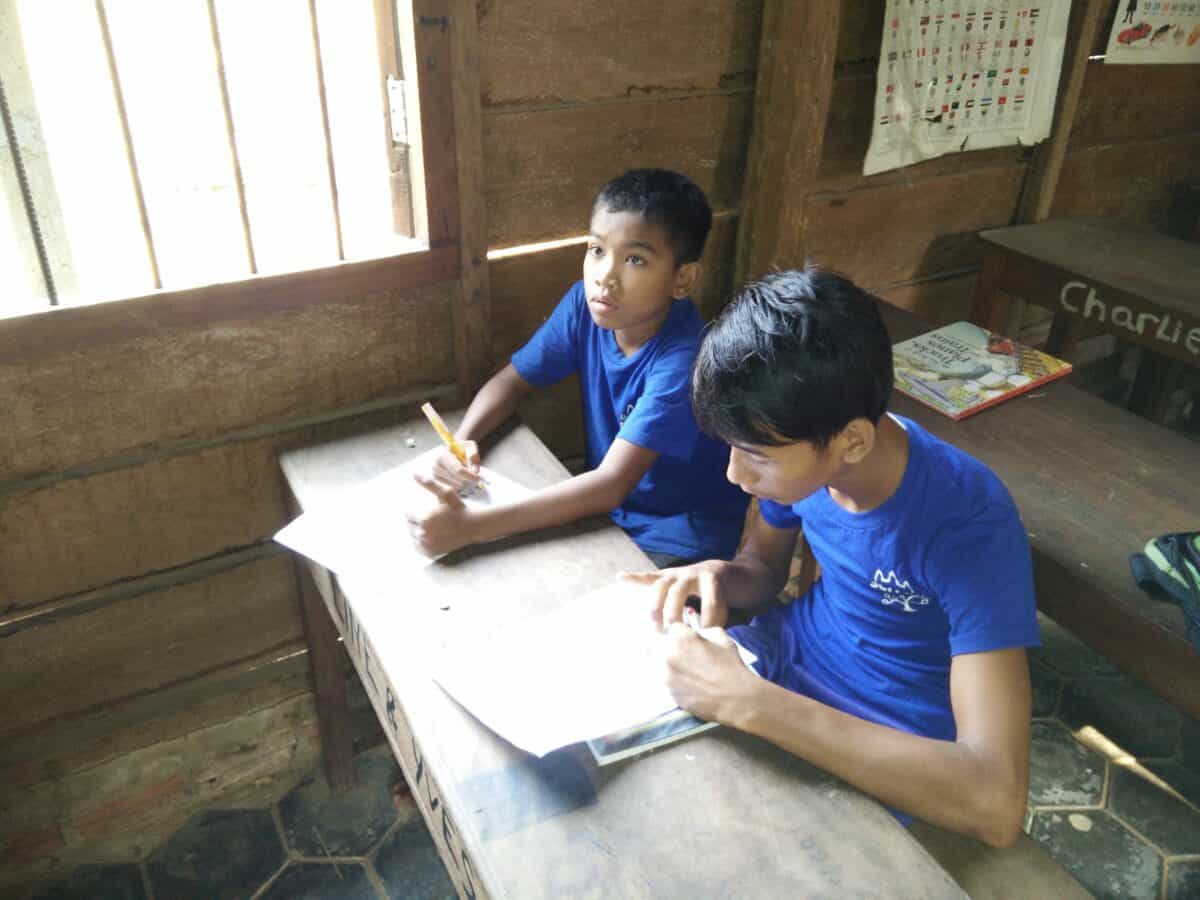 TDSO A simple wooden barrack, a class in a Cambodian community school