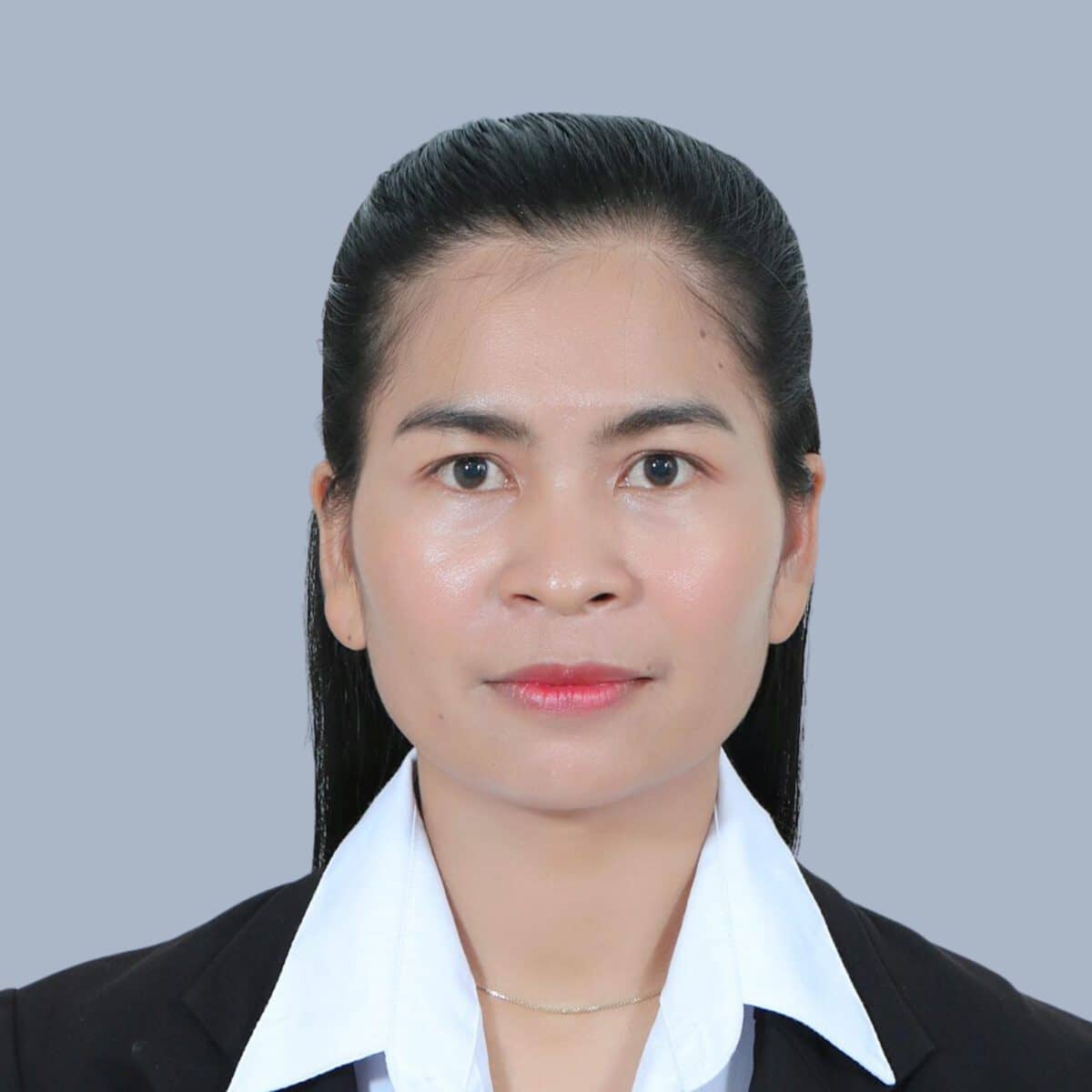 TDSO Professional woman in business attire, looking confidently at the camera, representing teacher devel.