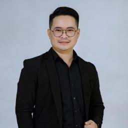 TDSO Teacher Development Support Organisation professional portrait of a smiling man in formal attire.